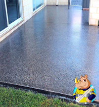 a concrete patio with a giraffe on it